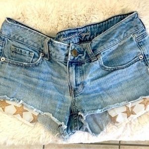 American Eagle denim shorties with star pocket hanging